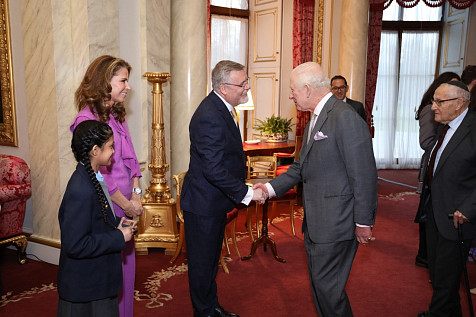 NYMT CEO Adrian Packer CBE is greeted by His Majesty the King.